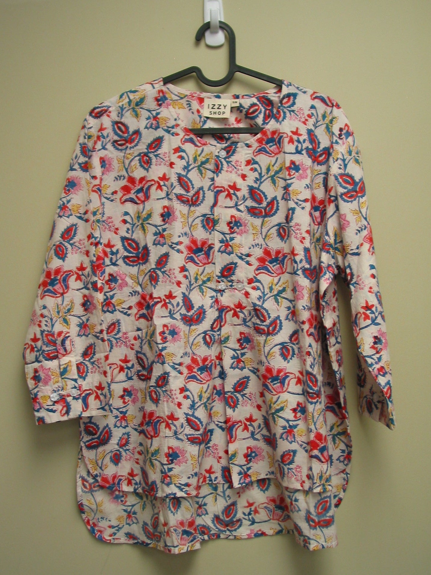 Floral patterned on a hanger against a beige background