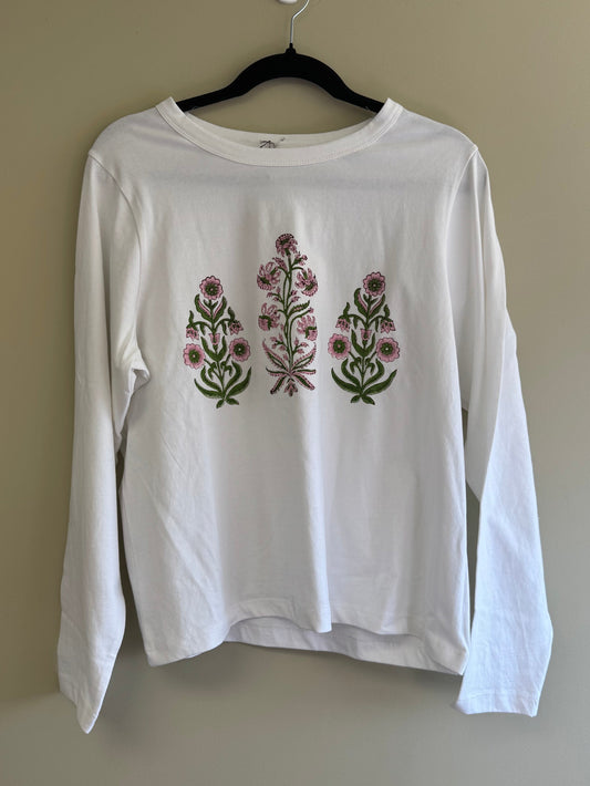 White shirt with floral print on a beige background